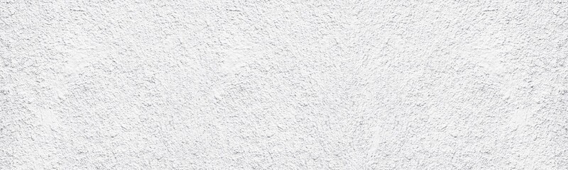 Whitewashed old rough concrete wall wide texture. White painted textured cement plaster panoramic abstract background