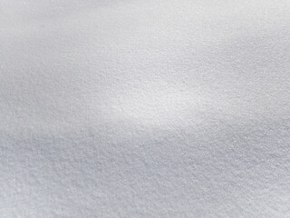 Background texture of white fresh snow sparkling in the sun, copy space, mobile photo