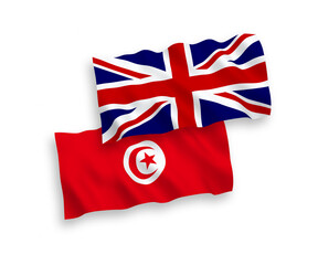 National vector fabric wave flags of Great Britain and Republic of Tunisia isolated on white background. 1 to 2 proportion.