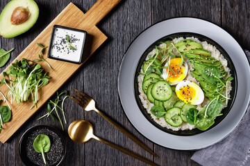 quinoa bowl with greens, avocado and boiled egg