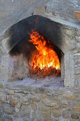 A traditional old stone outdoor wood fired oven