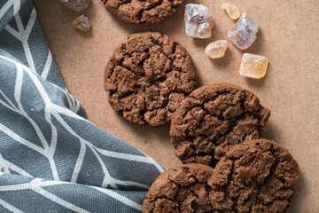 Crunchy chocolate chip cookies next to a kitchen towel and sugar crumbs. Delicious and healthy...