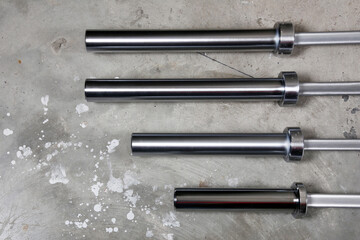 Barbell bar on the old garage ground