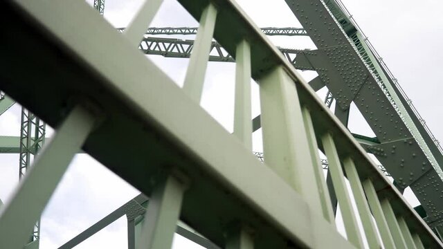 Looking up at Industrial steel bridge strong low angle girder beam support framework dolly right