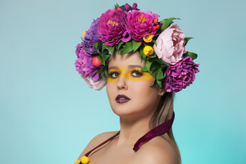 Fototapeta premium Beautiful brunette woman with flower wreath on her head.