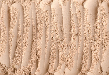 Homemade mineral face powder foundation or dry shampoo texture close up, selective focus. Make up background.