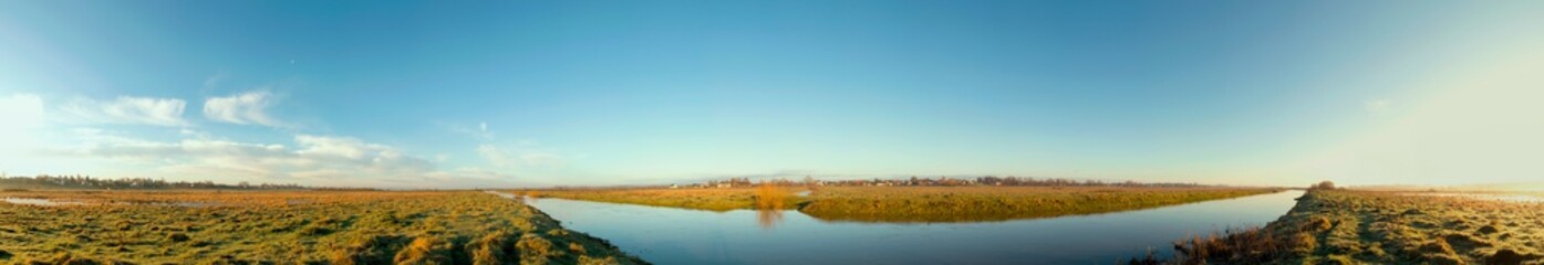 Fototapeta na wymiar river overflow on a sunny cloudless day
