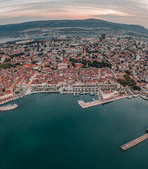 Aerial drone shot of Diocletian Palace in Split old town with lights before sunrise in Croatia