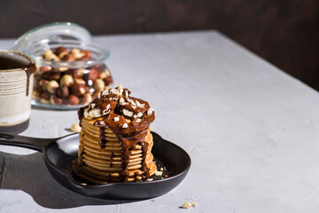pancakes with banana, chocolate and hazelnuts