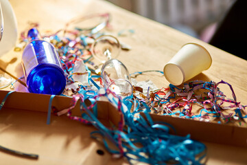 Messy wooden table at morning after party.