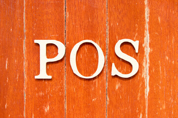 Alphabet letter in word POS (abbreviation of point of sale) on old red color wood plate background