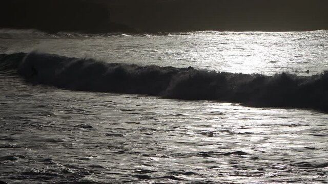 Surfer in Gran Canaria island beach el rincon on back light