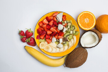 Fruit salad from banana, strawberry, orange, coconut and etc.