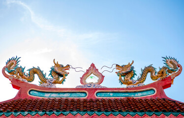 Old dragon statues, popularly installed at the gates of Chinese temples or shrines