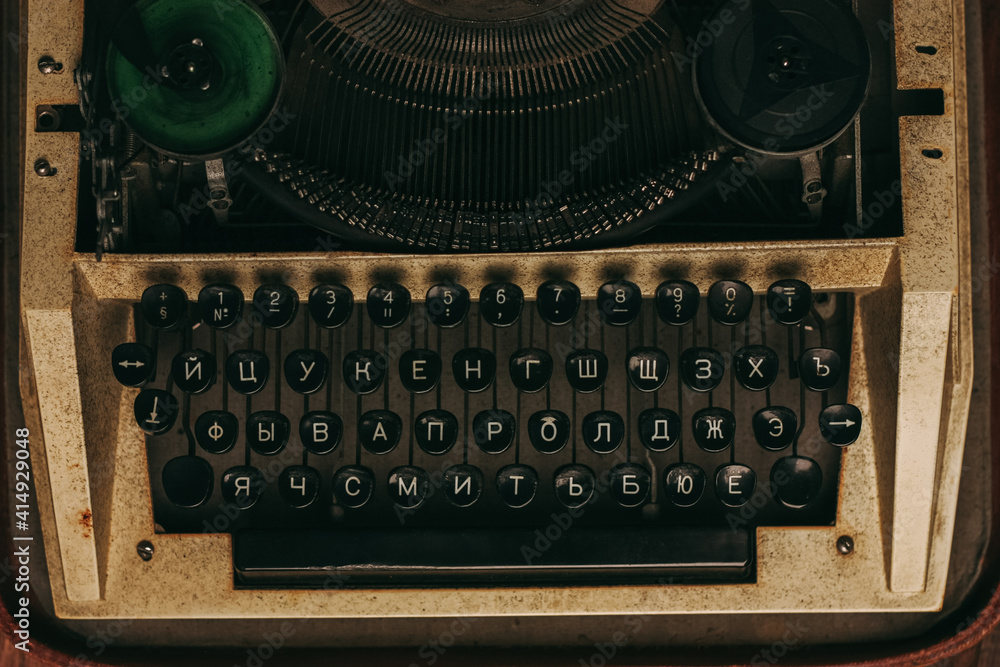 Fototapete typewriter with keys on a wooden background retro style close-up macro