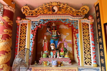 Hoi An, Vietnam, February 18, 2021: Altar at the entrance of the Phap Bao Temple. Hoi An, Vietnam