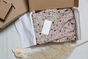 Top view at floral hand made dress. Small business, handmade small series production. Ethical sustainable fashion from natural materials