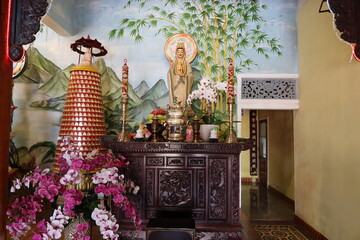 Hoi An, Vietnam, February 18, 2021: One of the altars in the main hall of the Phap Bao Temple. Hoi An, Vietnam