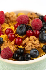 Corn flakes and fresh raspberry and blueberry