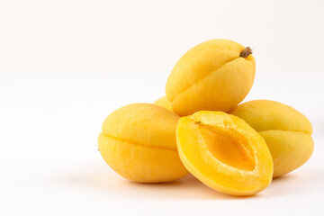 Fototapeta na wymiar Yellow apricots on white background
