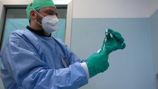 Europe, Italy, Milan 02-18-2021 - Start of Covid-19 Coronavirus vaccination at the military hospital in Via Saint Bon - Army and military administer dose to over eighty year olds 