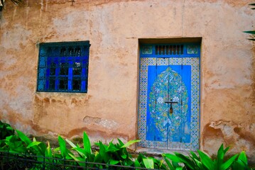 Fototapeta na wymiar Windows and doors - Blue window and blue door in Rabat, Morocco