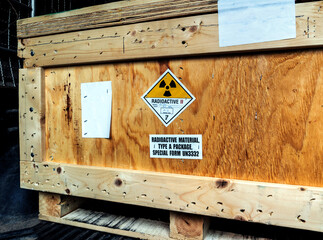 Radiation label beside the transport wooden box Type A package