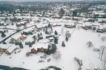 Winter snow storm across the United States covers midwest neighborhoods and homes