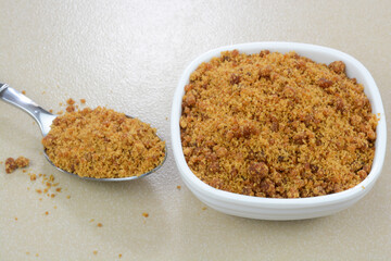 Closeup view of Jaggery powder in a bowl
