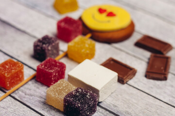 multicolored marmalade and sweets dessert snack wooden background