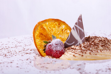 fresh homemade custard, with orange and strawberry