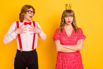 Photo portrait of funny geek amazed charmed with unhappy irritated girl valentines day isolated bright yellow color background © deagreez