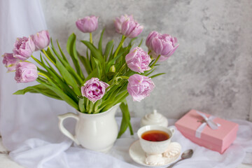 still life bouquet of tulips in a vase tea mug gift