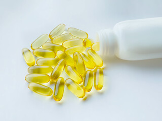 Omega-3 capsules with the bottle on white background. Polyunsaturated fatty acids. The concept of a healthy lifestyle.