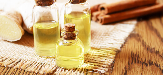 Ginger essential oil in a small bottle. Selective focus.