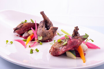 braised quail with seasonal vegetables