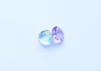 Multi-colored gemstones, topaz and amethyst. Tumbled and cut stones.