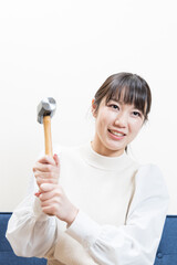 Woman wielding a hammer