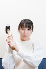 Woman wielding a hammer