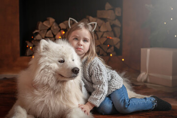  Girl and samoyed husky dog. Home