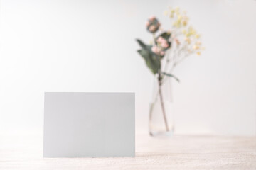 White blank letter greeting card, mockup on white background. Romantic love letter, invitation with flowers, copy space for text