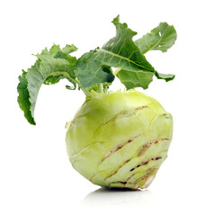 Fresh kohlrabi with green leaves on isolated white backround