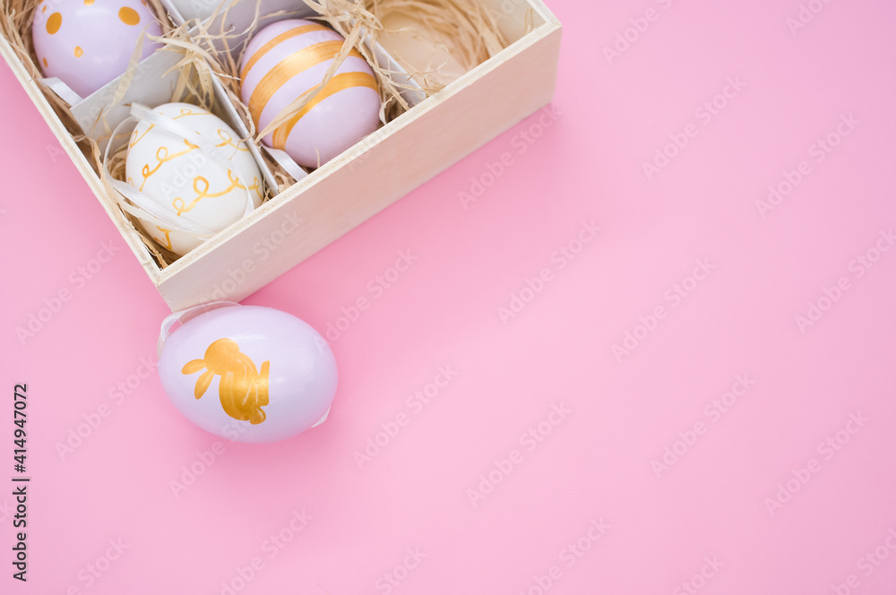 Aufkleber top view of painted easter eggs on a box with straw isolated on pink background with copy space