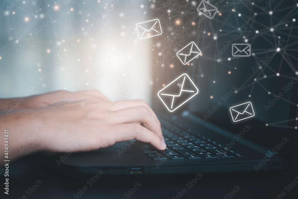 Poster closeup businessman hand using computer laptop with email icon and connection line.