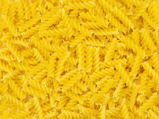 Italian pasta (Gomiti Rigati) on white background