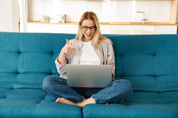 Attractive young smiling woman on a video call