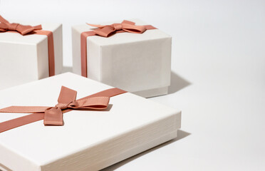three white gift boxes on empty white background
