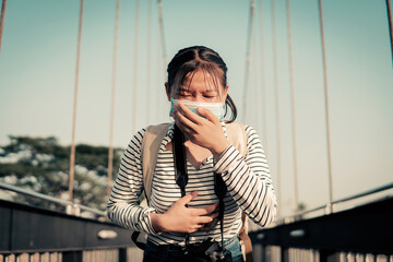 The new normal a girl wearing a mask during travel and public place. Covid-19 concept self-care.