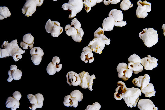 popcorn falls on a black background
