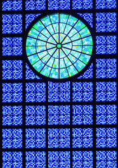 Modern main stained glass window of the National Sanctuary Basilica of Our Lady of Aparecida, in Brazil. Made of square shaped glasses with different bluish tones, and having a rosette of greenish ton